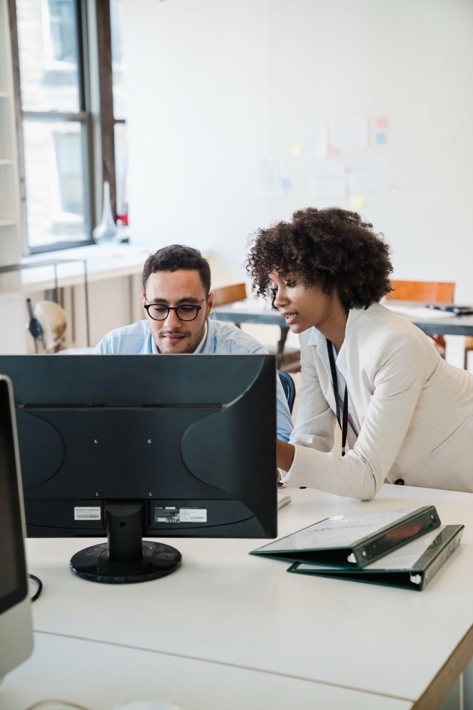 Two people planning a website at a screen